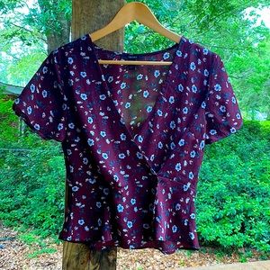 Sheer blouse with wrap around front attached by buttons. Deep V for flirty vibe!